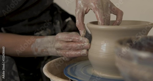Close Up of Pottery Artist at Work, Potter Master Creating Clay Pot on a Wheel