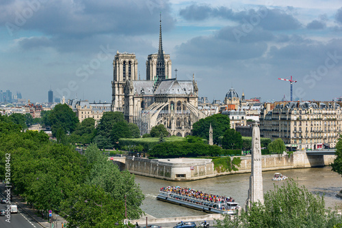 aerial view of Notre Dame de Paris Cathedral. Crowded ship on River Seine