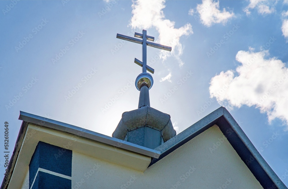General view and architectural details of the temple, the Orthodox Church of the Kaspierowska Icon of the Mother of God, built in 1996, in the village of Widowo in the south of Poland. General view and architectural details of the temple, the Orthodox Church of the Kaspierowska Icon of the Mother of God, built in 1996, in the village of Widowo in the south of Poland.