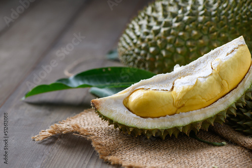 Puangmanee durian on wood plate and wood background, It's a small durian.