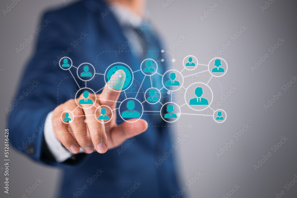 A businessman presses a modern technology web panel with his fingerprint A businessman presses a modern technology web panel with his fingerprint