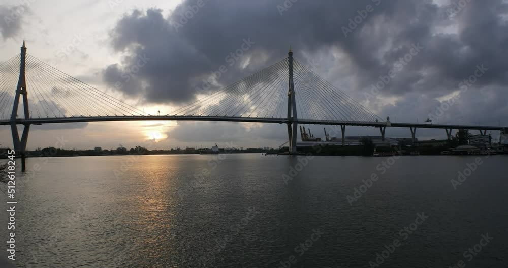 Bangkok boat and Chao Phraya River cruise under cloudy sun with bridge in the background, Thailand - timelapse photo Bangkok boat and Chao Phraya River cruise under cloudy sun with bridge in the background, Thailand - timelapse photo