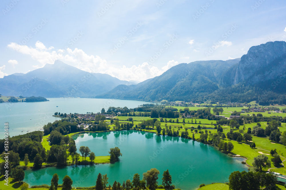 Fototapeta premium Aerial of Mondsee lake and golfing fields, Mondsee, Austria