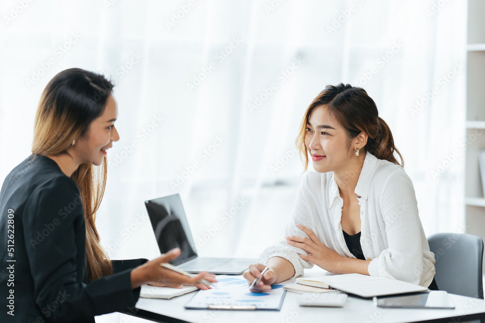 Happy young business colleagues in modern office,Two confident business ladies. Happy young business colleagues in modern office,Two confident business ladies.
