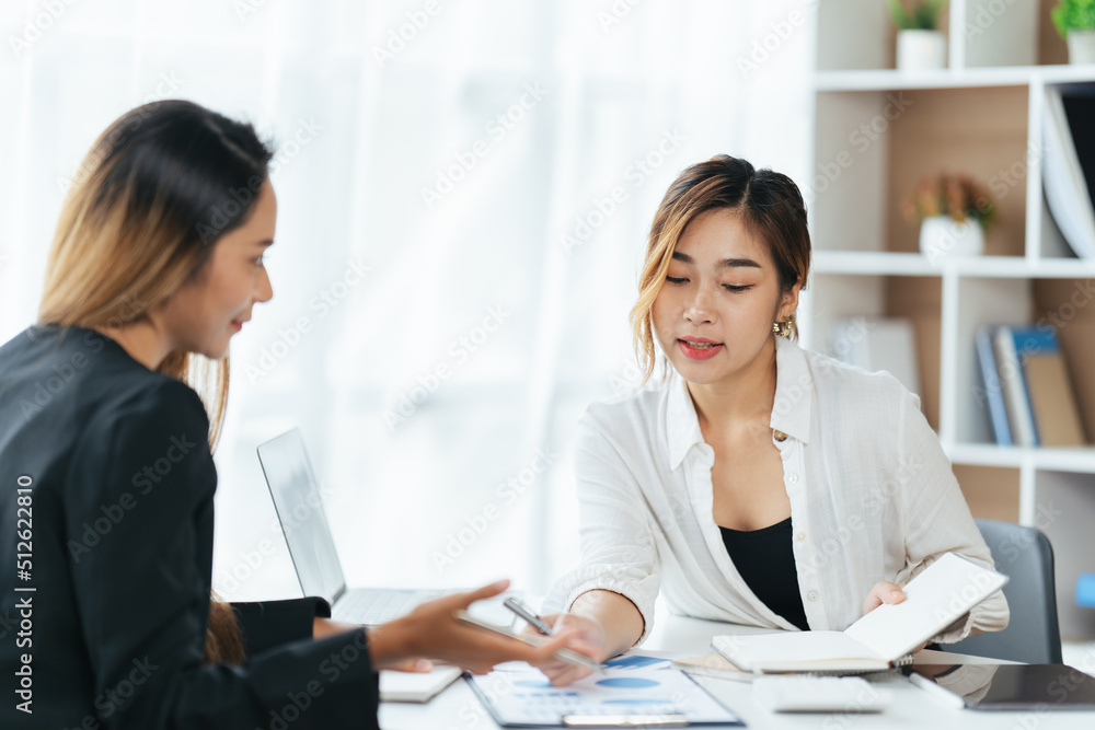 Happy young business colleagues in modern office,Two confident business ladies. Happy young business colleagues in modern office,Two confident business ladies.