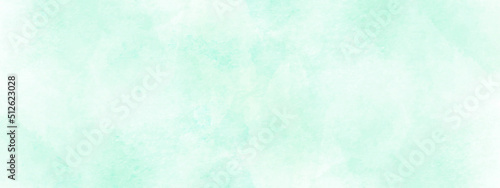 Beautiful and shinny cloudy watercolor background, sky blue shades light green paper texture, beautiful blue or green background with white clouds.