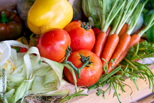 Closeup of freshly harvested organic vegetables (Carrots,Tomatoes,pumpkins,bell pepper,Corn)