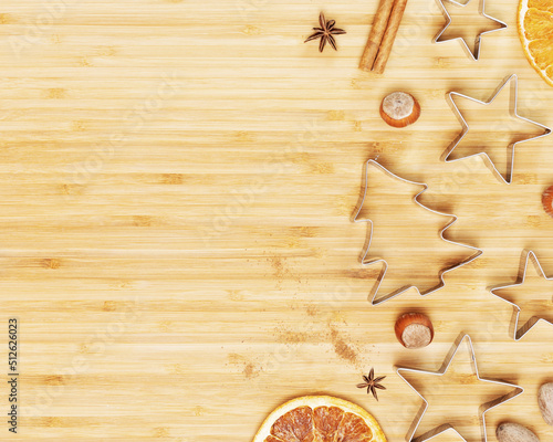 Christmas and New Year, eco friendly background. Cooking homemade Christmas cookies. Cookie cutters with dried fruits, nuts and spices on a wooden board with copy space. Flat lay
