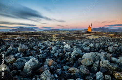 Hopsnes Lighthouse on Icelands south coast during sunset.Near the town of Grindavik. photo