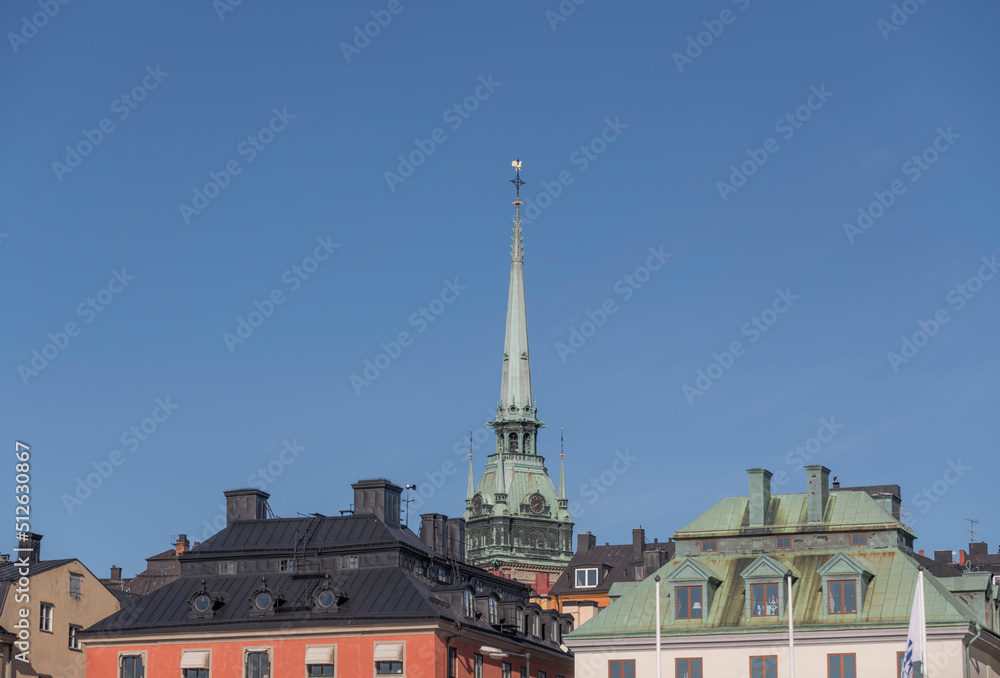 Roofs and the tower of the German church Tyska Kyrkan a summer day in Stockholm