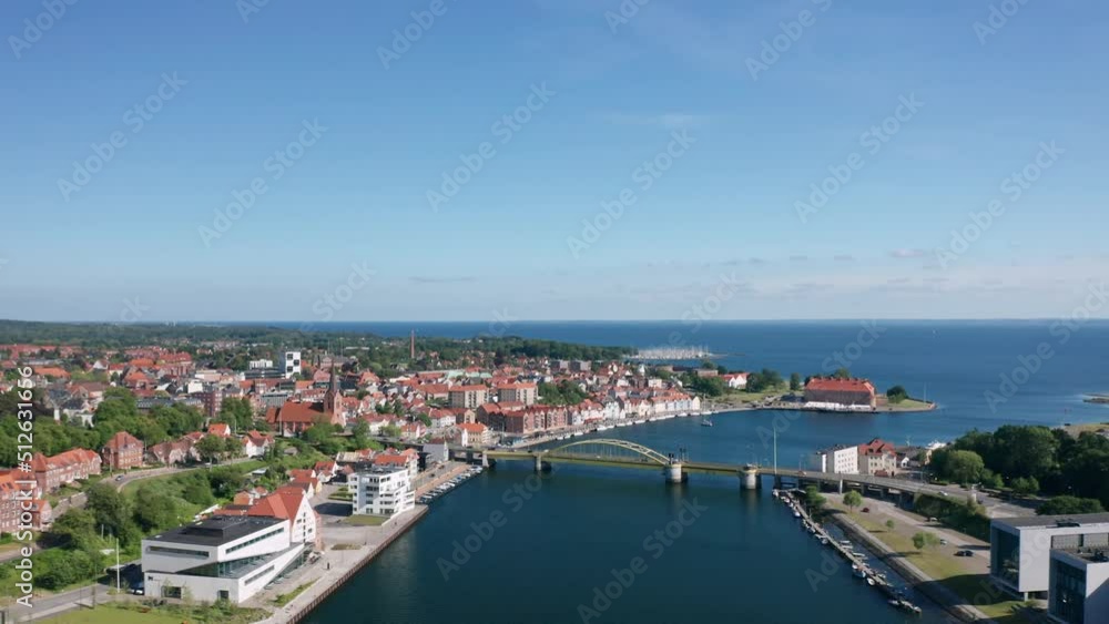 Cityscape of Sonderborg (Sønderborg, Denmark) on sunny summer day. Panoramic aerial view on the city center and castle Cityscape of Sonderborg (Sønderborg, Denmark) on sunny summer day. Panoramic aerial view on the city center and castle
