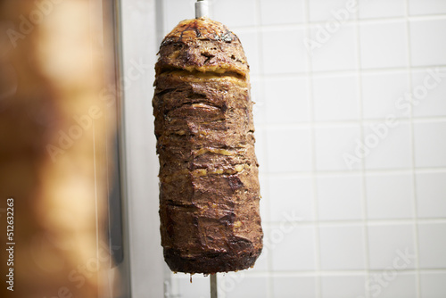 Juicy meat on a spit. Beef. Meat for shawarma on a spit. 