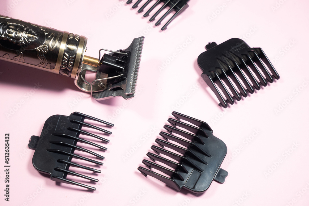 Electric metal razor or dry shaver with set of attachments for