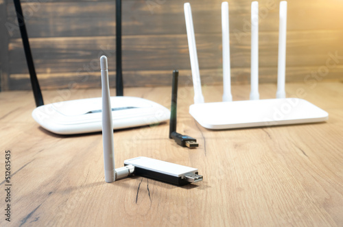 Different types of Wi-Fi routers  modern and old technology. Wireless ethernet connection signal. USB Wifi Receiver Wireless Network Card. High Speed Antenna Wifi Adapters.