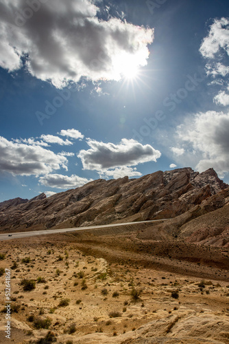 landscape in the desert with clouds and rocks