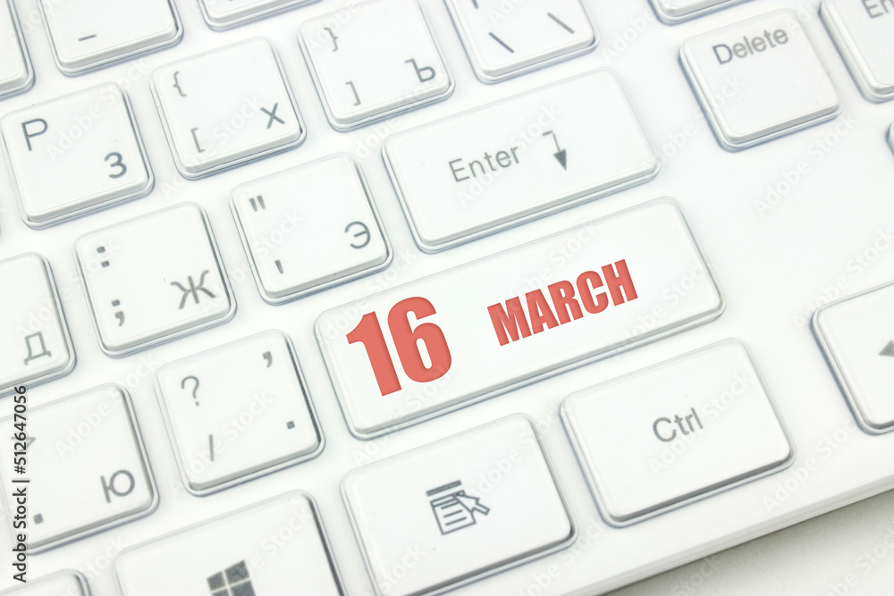 March 16th. Day 16 of month, Calendar date. Cropped view of Modern White Computer Keyboard with calendar date. Concept workspace, freelance, deadline. Spring month, day of the year concept. March 16th. Day 16 of month, Calendar date. Cropped view of Modern White Computer Keyboard with calendar date. Concept workspace, freelance, deadline. Spring month, day of the year concept.
