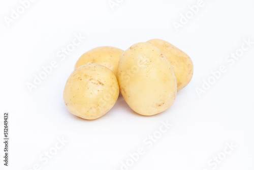  Young rustic raw potato on white background 