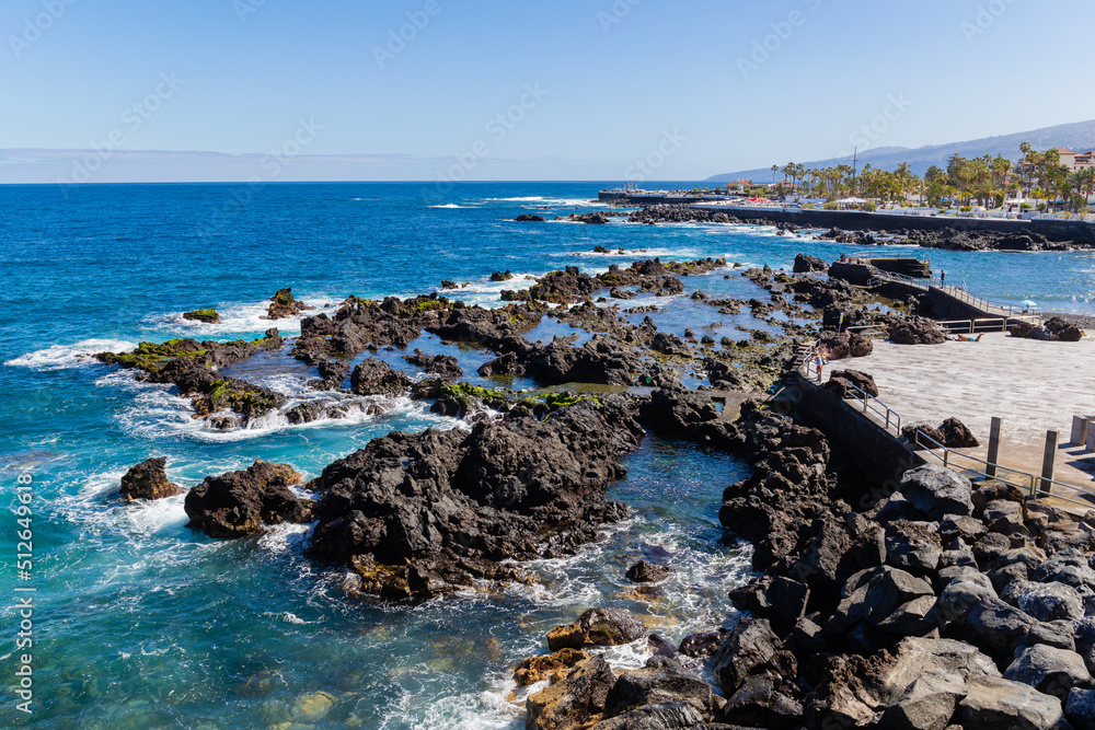 Puerto de la Cruz, Tenerife, Spain - Apr 9, 2022, Promenade in Puerto de la Cruz with tropical Canarian vegetation. Puerto de la Cruz, Tenerife, Spain - Apr 9, 2022, Promenade in Puerto de la Cruz with tropical Canarian vegetation.