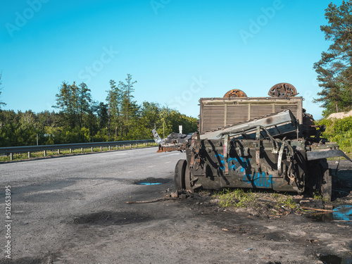 War in Ukraine  Kyiv region  Zhytomyr highway  a broken Russian tank stands near the highway  rear view  close-up
