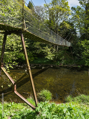 Suspension foot bridge at Bothal, Northumberland, UK photo