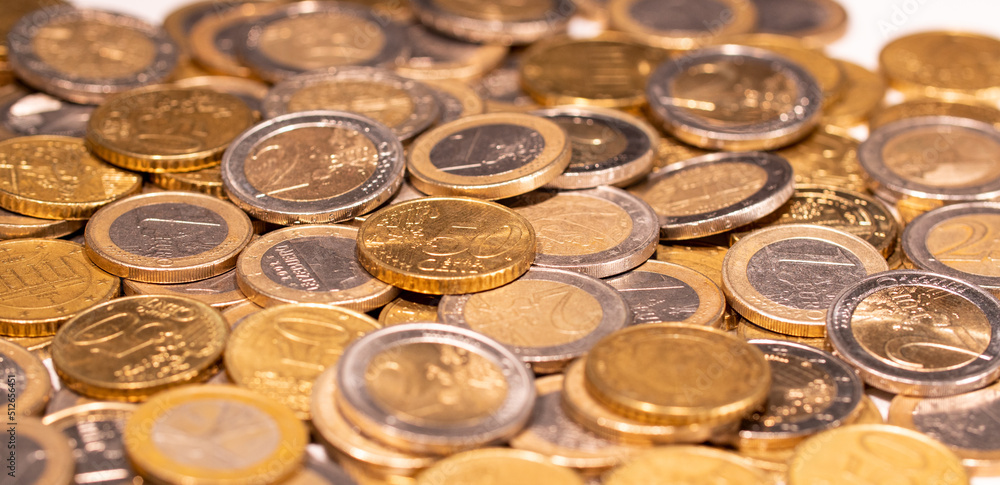 Heap of euro coins. Focus on the fifty cent coin. European currency. Heap of euro coins. Focus on the fifty cent coin. European currency.