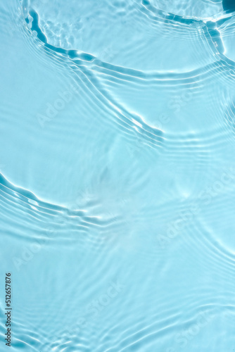 Water blue background water with waves and ripples. Cosmetic background concept