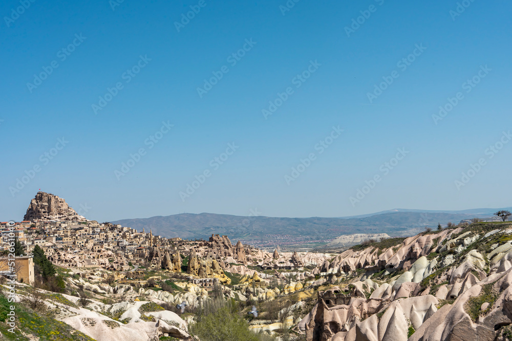 Uchisar panorama with Uchisar castle and rock formations, Cappadocia, Nevsehir, Turkey. Popular travel destination. Copy space for text.
