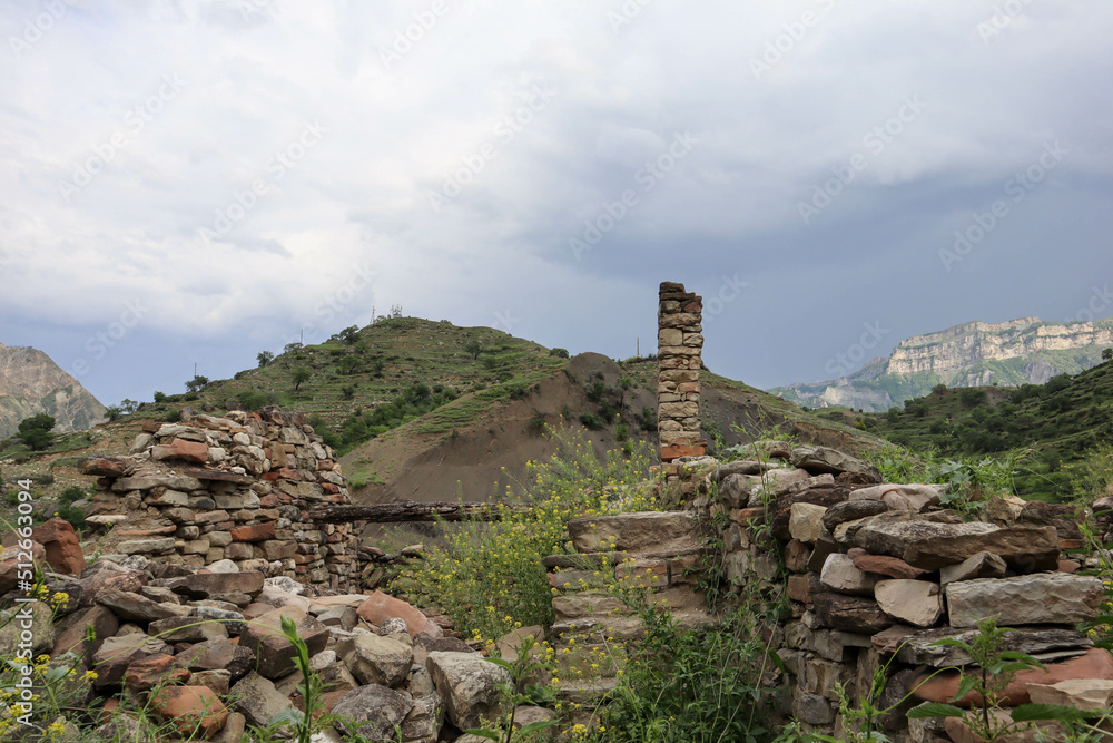 details of old ruined stone houses on the street in abandoned mountain village Old Koroda in Dagestan, Russia