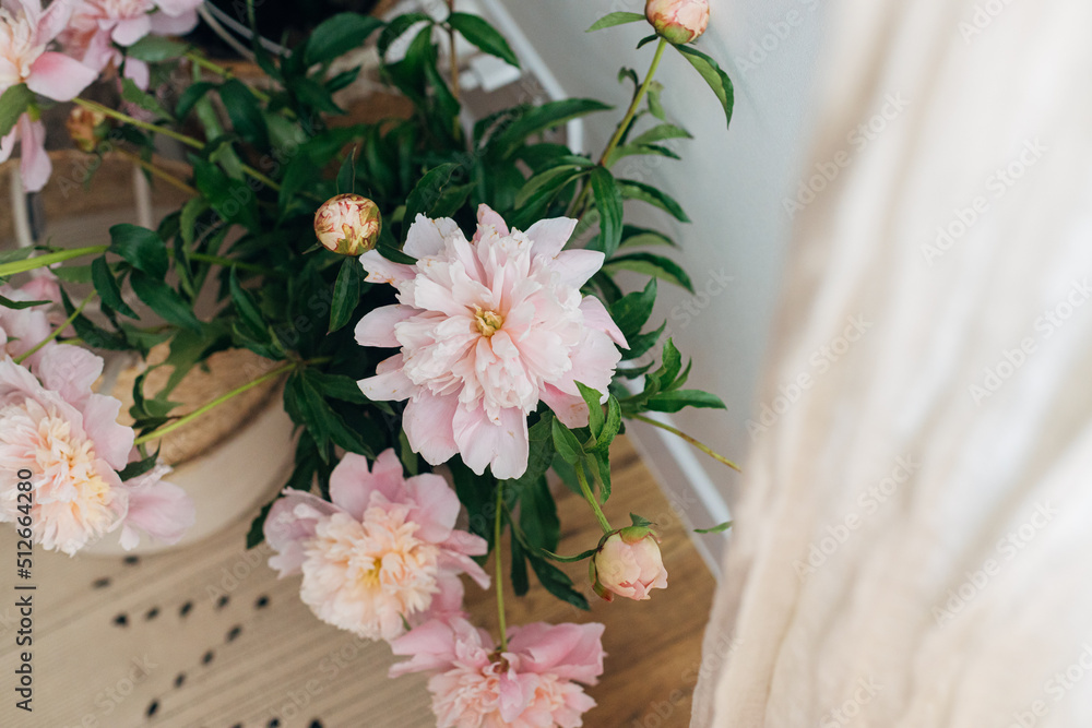 Beautiful peonies bouquet in modern boho room. Gentle pink peony ...