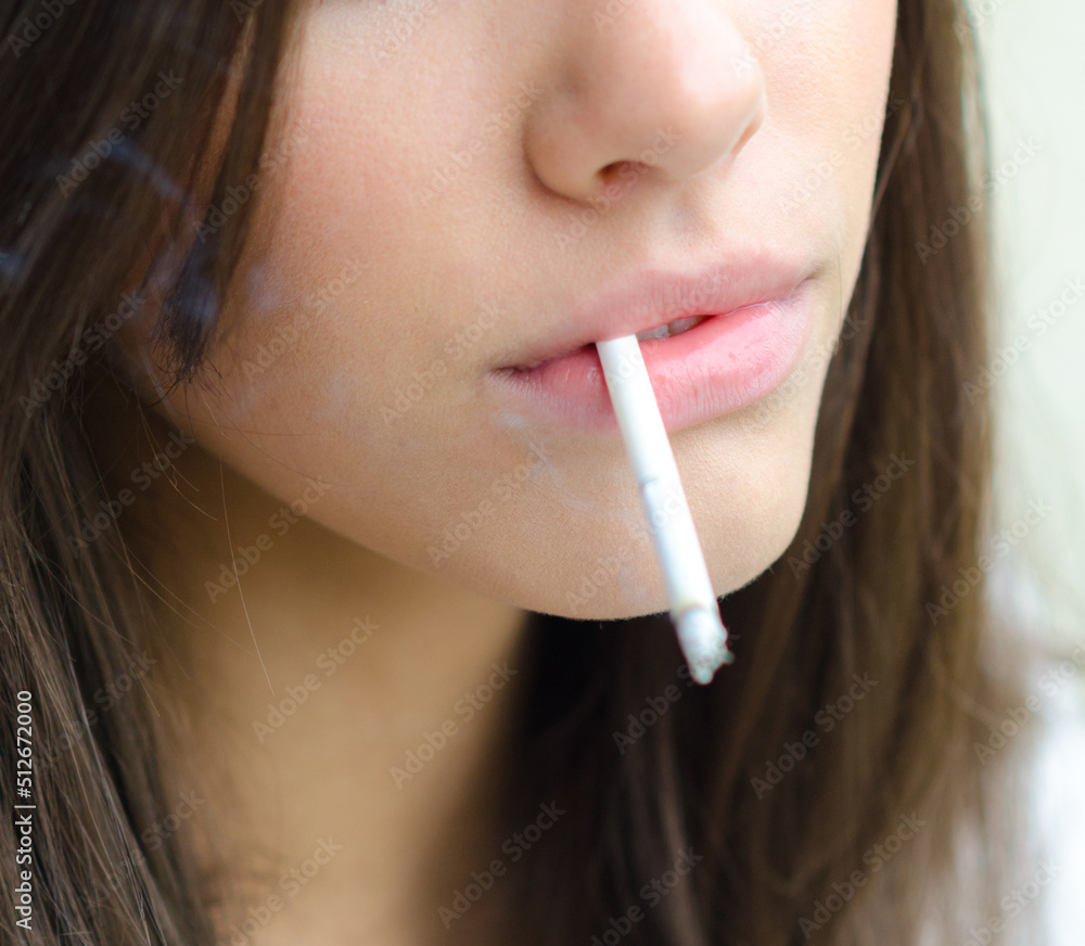 Young woman smoking cigarette Young woman smoking cigarette