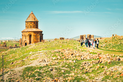 Church structure with organized tour group . Ani ruins archeological site eastern anatolia, Turkey photo