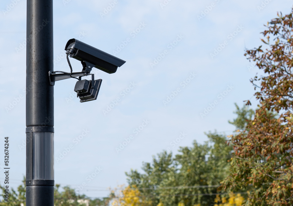 Modern CCTV security system on sky background Smart camera theft protection.