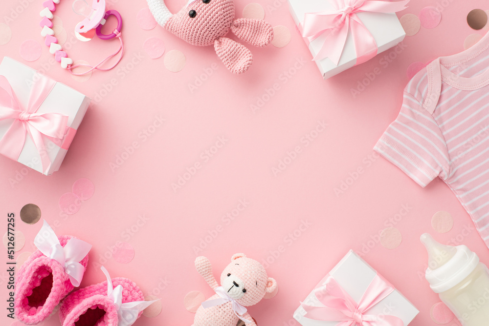 Baby girl concept. Top view photo of gift boxes shirt booties knitted bunny rattle toy teddy-bear pacifier chain bottle and confetti on isolated pastel pink background with copyspace in the middle