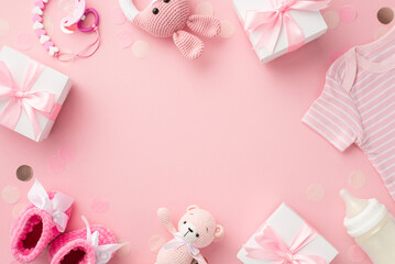 Baby girl concept. Top view photo of gift boxes shirt booties knitted bunny rattle toy teddy-bear pacifier chain bottle and confetti on isolated pastel pink background with copyspace in the middle