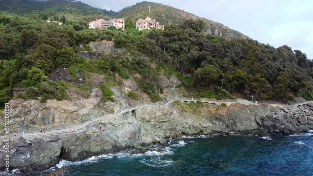 Europe, Italy , Framura , Liguria, 5 Terre - the new promenade by the sea (via del mare) - drone aerial view of seacoast with railway train binary - from Levanto to Framura with bike on board sea Europe, Italy , Framura , Liguria, 5 Terre - the new promenade by the sea (via del mare) - drone aerial view of seacoast with railway train binary - from Levanto to Framura with bike on board sea