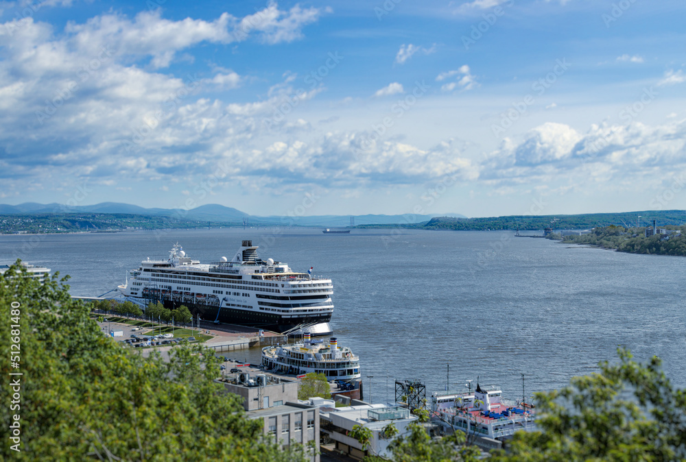 Cruise ship in Quebec City harbour with blue and cloudy skies at the background
