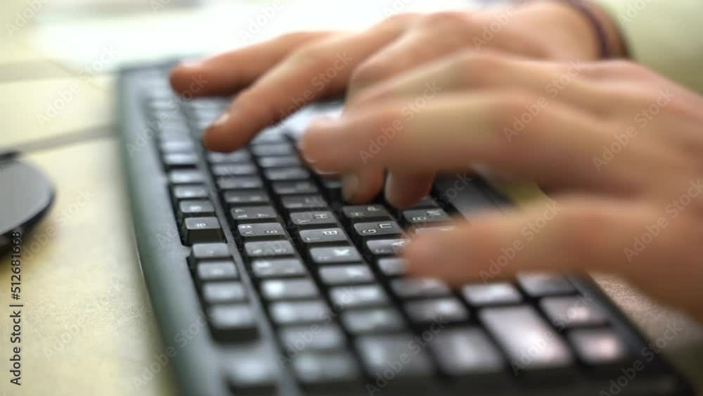A man is typing on a keyboard. Close-up. Education and business concept. A man is typing on a keyboard. Close-up. Education and business concept.