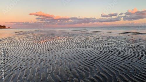 Photo Sunset looking East from Stratford CT over the sands of lowtide and Long Island