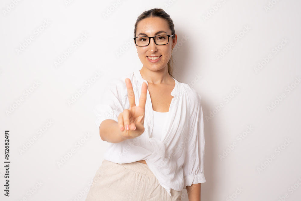 Young brunette business woman isolated on white background showing number two with fingers. Young brunette business woman isolated on white background showing number two with fingers.
