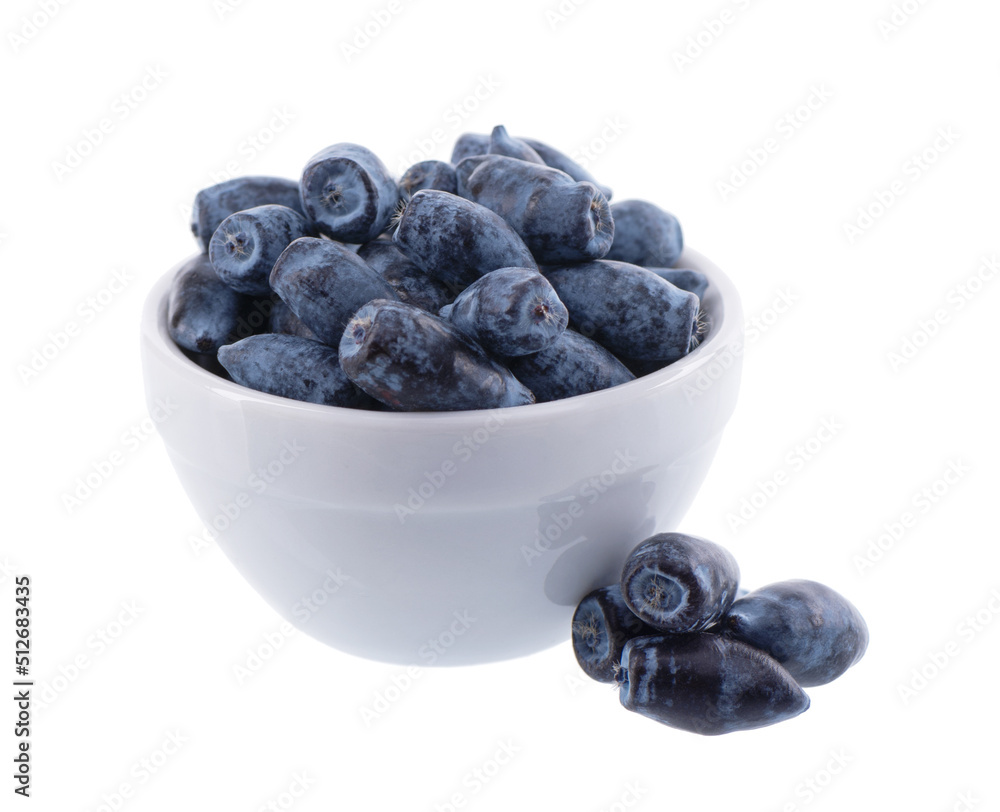 Honeysuckle berries white ceramic bowl, isolated on white background. Ripe berries of honeysuckle. Clipping path. Honeysuckle berries white ceramic bowl, isolated on white background. Ripe berries of honeysuckle. Clipping path.