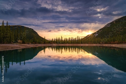 Fototapeta Naklejka Na Ścianę i Meble -  Panoramic Sunrise Reflecting On A Park Lake