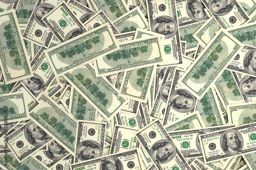 Background of American dollar bills. Creative money pattern. Banknotes are arranged randomly. Background of American dollar bills. Creative money pattern. Banknotes are arranged randomly.