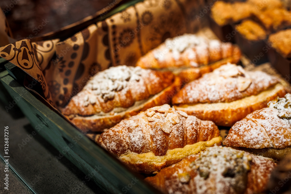 Various fresh bakery , pastry on display window, pie, chocolate and vanilla croissant Various fresh bakery , pastry on display window, pie, chocolate and vanilla croissant