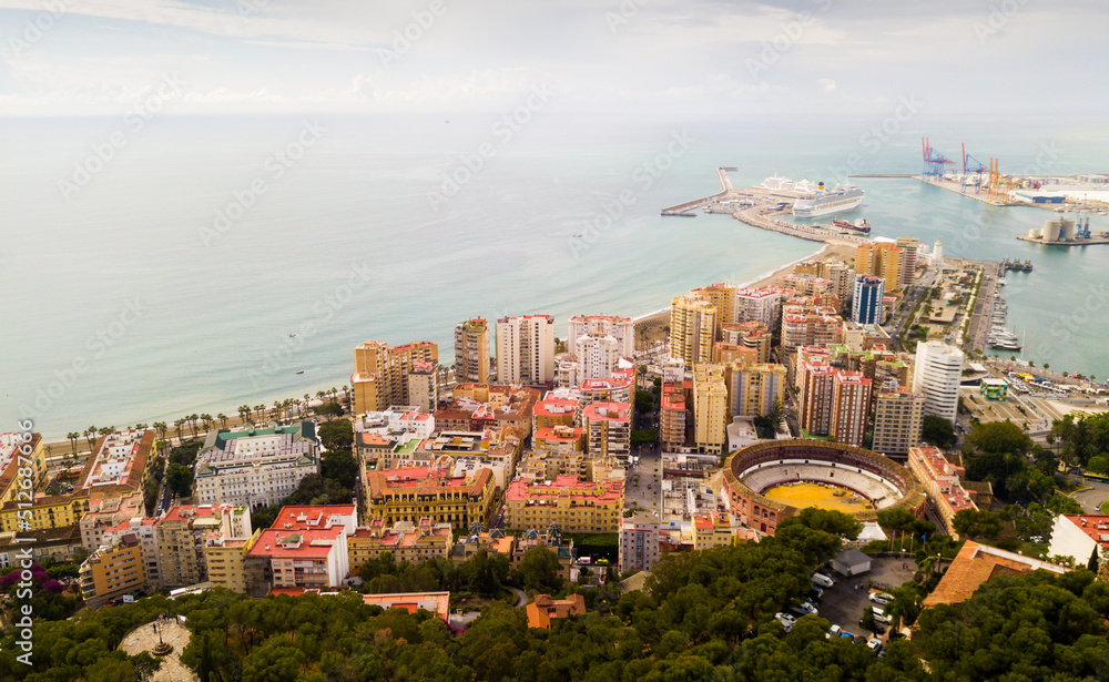 Panoramic view of Mediterranean coastal city of Malaga with harbor, Spain