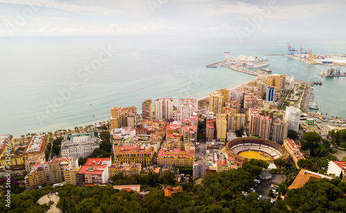 Panoramic view of Mediterranean coastal city of Malaga with harbor, Spain