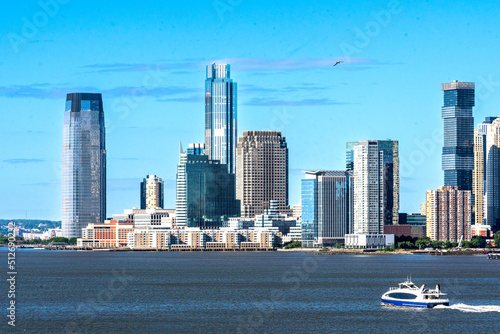 Jersey City, NJ - June 18, 2022 A horizontal  view of the Hudson River and the iconic skyline of Exchange Place and Harborside Plaza, a neighborhood in downtown Jersey City. Site of Financial firms.
