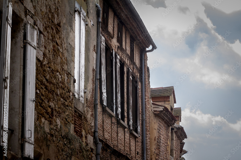 Facade of old houses, medieval buildings, in a typical french medieval village and city, bergerac, in France, in Dordogne and Perigord, with a typical of the Southwestern French architecture...