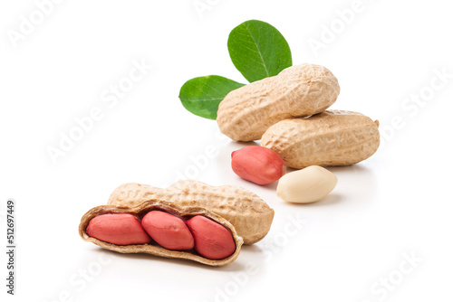 unpeeled and whole shell peanuts with leaves isolated on white background.
