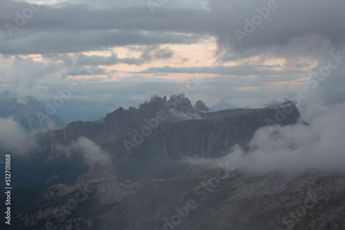 Mountain landscape in dense clouds. The Cinque Torri seen from above of South side, Dolomites.