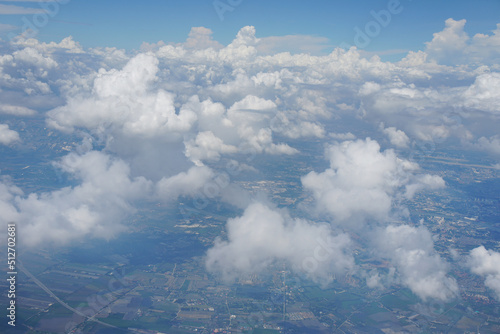 fluffy white cumulus clouds, detached, individual, cauliflower-shaped clouds usually spotted in fair weather conditions. © Montree